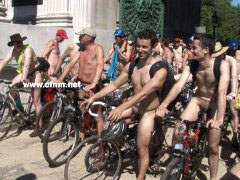 Hundreds of naked men cycle through streets lined with clothed female voyeurs